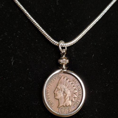 Close view of genuine Indian Head Cent pendant in silver-plated bezel