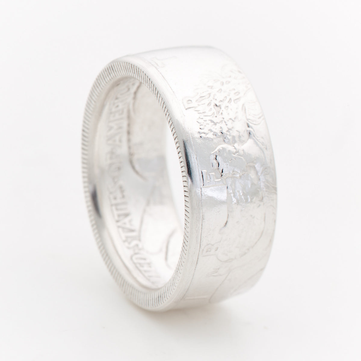 Walking Liberty Half Dollar coin ring with the obverse facing out, showing the handcrafted silver band