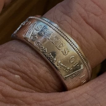 Customer wearing a silver CoinCrafters coin ring